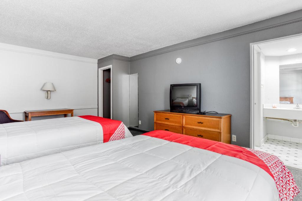 Luxury bedroom with plush bedding and city skyline view